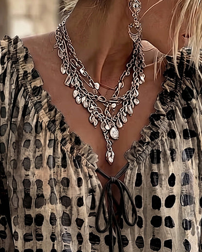 Lena | Blouse met stippenpatroon en vetersluiting