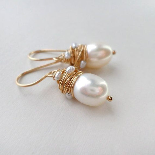 Vintage parel oorbellen met gouden draden