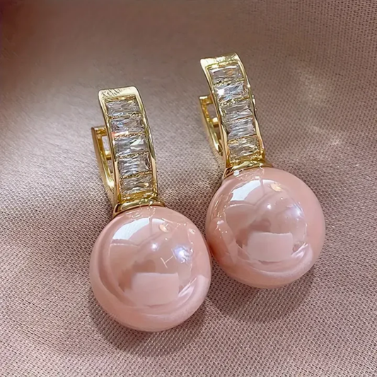 Roze en gouden zirconium oorbellen